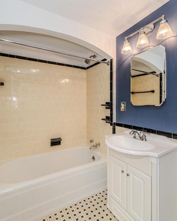 bathroom with shower / bath combination, tile patterned floors, and vanity