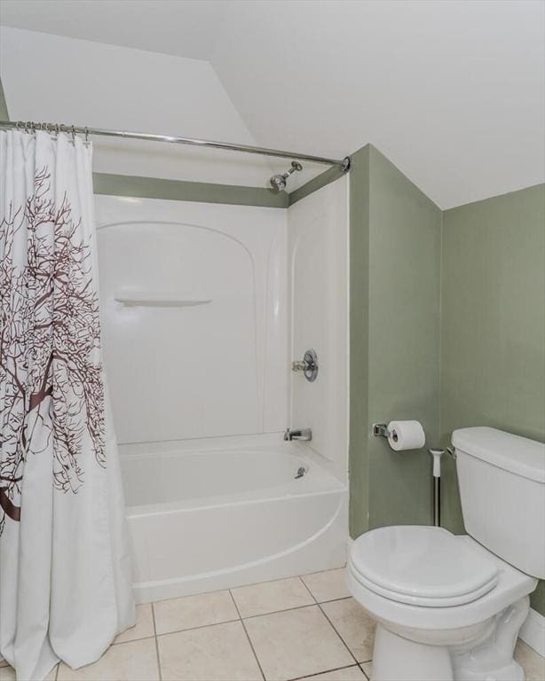 full bathroom with toilet, shower / tub combo, and tile patterned flooring