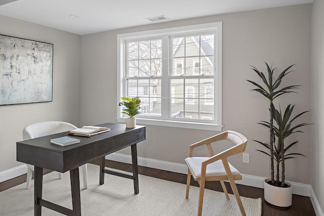 office area with wood-type flooring and plenty of natural light