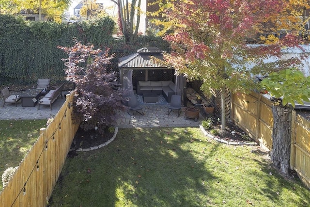 view of yard featuring a gazebo, outdoor lounge area, and a patio