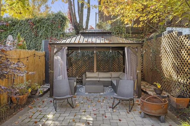 view of patio featuring an outdoor hangout area and a gazebo