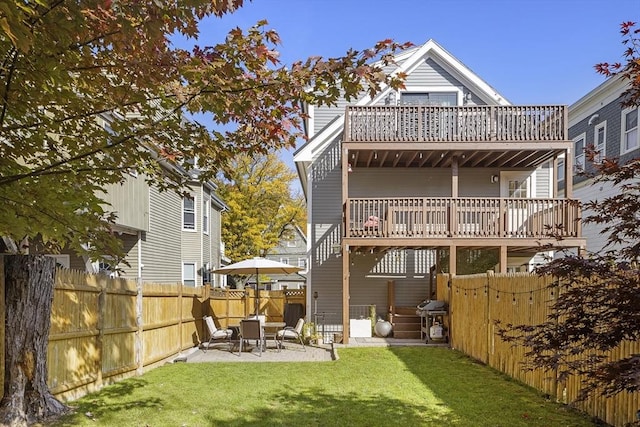 back of property featuring a patio and a lawn