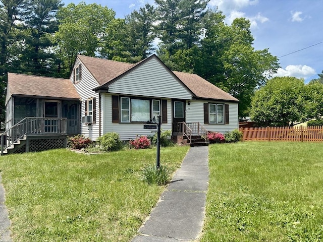 20 Birch St, Acushnet, MA 02743 - view of front facade with roof with shingles, cooling unit, and a sunroom
