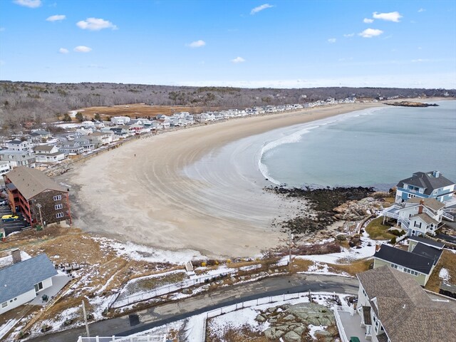 snowy aerial view featuring a water view