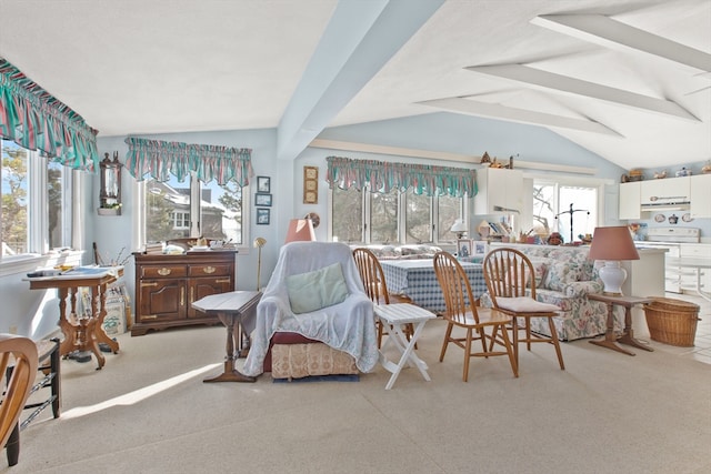 living area featuring light carpet and vaulted ceiling with beams