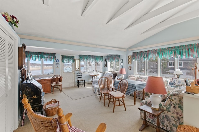 living room featuring lofted ceiling with beams and light carpet