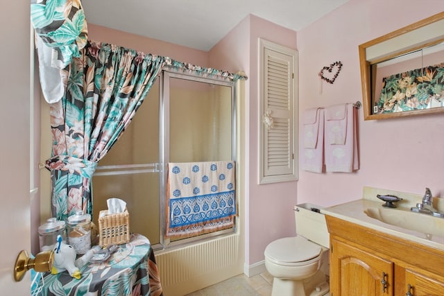 bathroom featuring vanity, an enclosed shower, tile patterned floors, and toilet