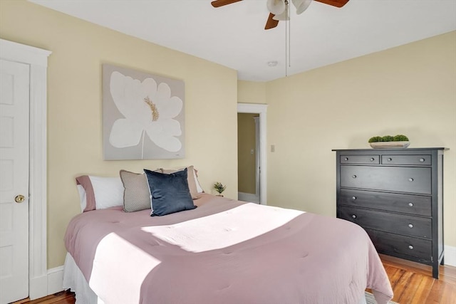 bedroom featuring ceiling fan and wood-type flooring