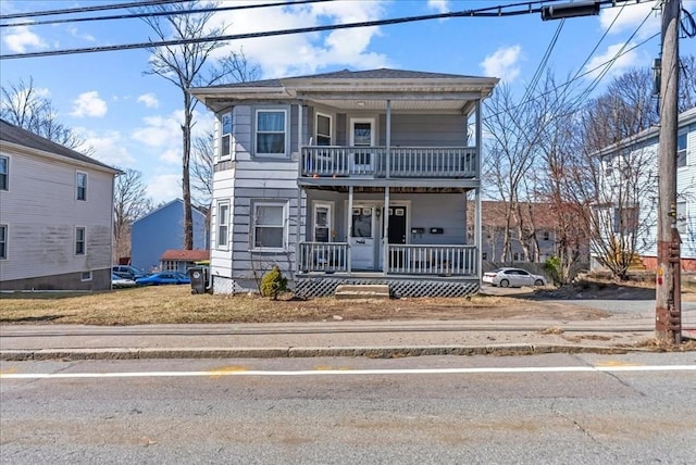 view of front of home with a porch and a balcony