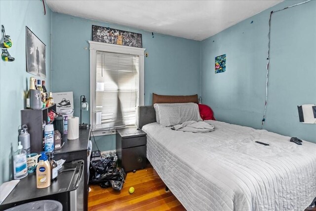 bedroom featuring wood finished floors