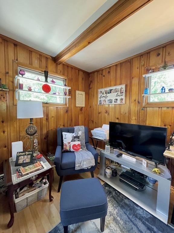 27 Springvale Ave, Lynn, MA 01904 - sitting room with beamed ceiling, wood walls, and wood finished floors