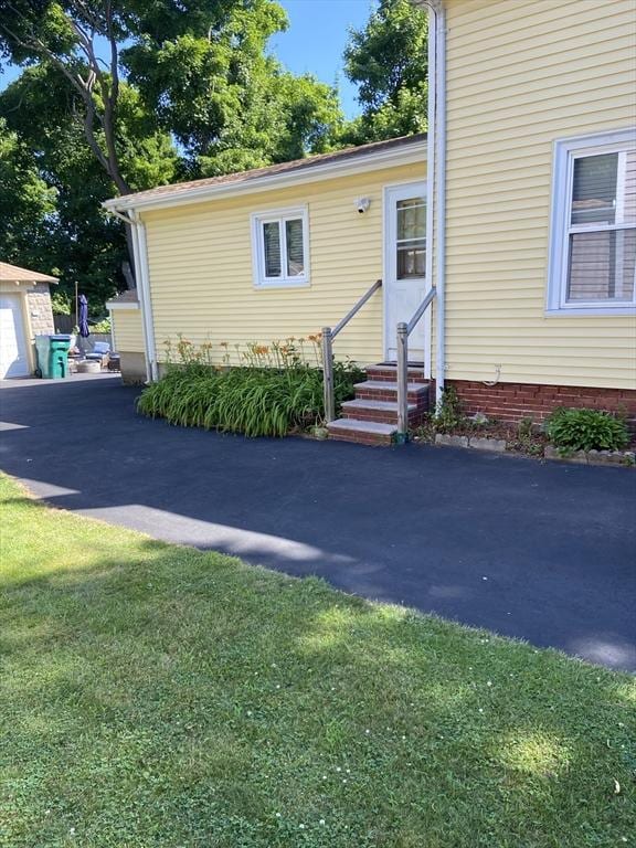 27 Springvale Ave, Lynn, MA 01904 - view of front of home with entry steps and a front yard