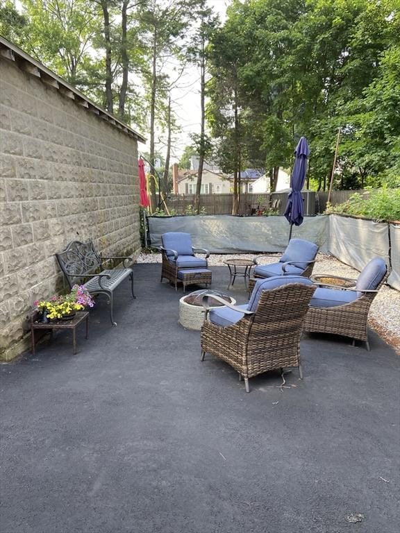 27 Springvale Ave, Lynn, MA 01904 - view of patio / terrace featuring fence and an outdoor fire pit