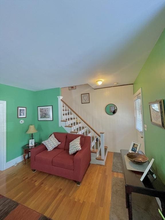 27 Springvale Ave, Lynn, MA 01904 - living room featuring wood finished floors, stairs, and baseboards