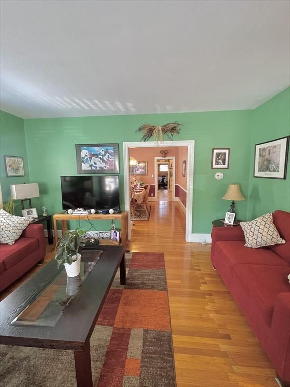 27 Springvale Ave, Lynn, MA 01904 - living area featuring wood finished floors and baseboards