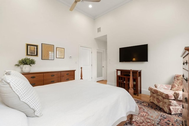 101 Waban St Unit 101, Newton, MA 02458 - bedroom with ornamental molding, baseboards, a high ceiling, light wood-style flooring, and ceiling fan