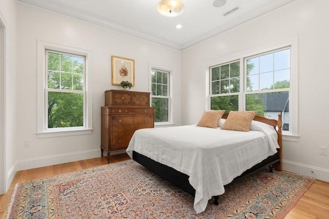 101 Waban St Unit 101, Newton, MA 02458 - bedroom featuring wood finished floors, baseboards, and crown molding