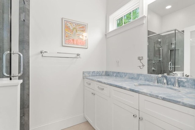 101 Waban St Unit 101, Newton, MA 02458 - full bathroom with vanity, a stall shower, baseboards, and tile patterned flooring