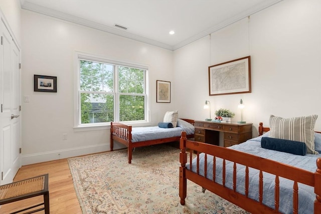 101 Waban St Unit 101, Newton, MA 02458 - bedroom featuring ornamental molding, light wood-type flooring, baseboards, and recessed lighting