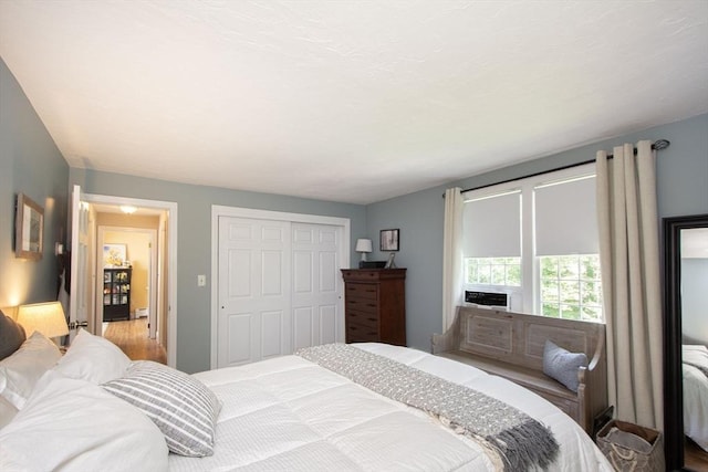 21 Flintlock Ridge Rd, Cohasset, MA 02025 - bedroom featuring wood finished floors and a closet