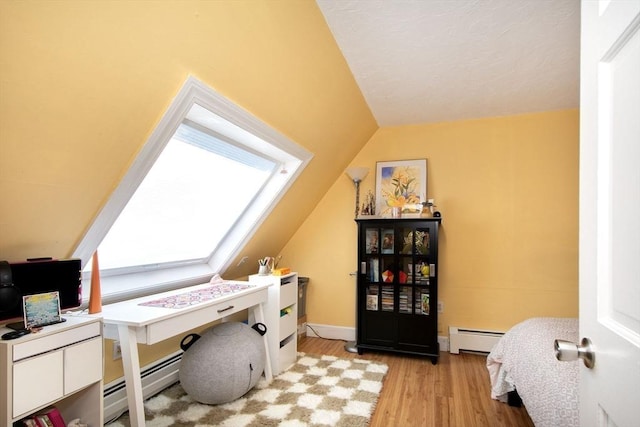 21 Flintlock Ridge Rd, Cohasset, MA 02025 - office space with baseboard heating, vaulted ceiling, and light wood-style flooring