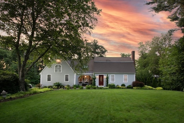 21 Flintlock Ridge Rd, Cohasset, MA 02025 - view of front facade featuring a front lawn and a chimney