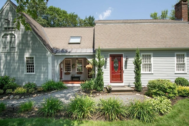 21 Flintlock Ridge Rd, Cohasset, MA 02025 - view of front of house featuring a porch, a shingled roof, and a chimney