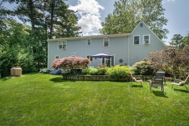 21 Flintlock Ridge Rd, Cohasset, MA 02025 - back of property featuring a lawn