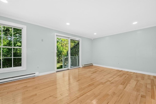 unfurnished room with baseboard heating, light wood-style floors, crown molding, baseboards, and recessed lighting