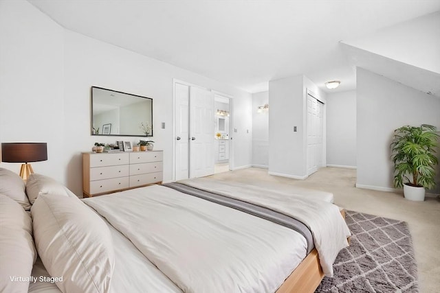 carpeted bedroom with baseboards