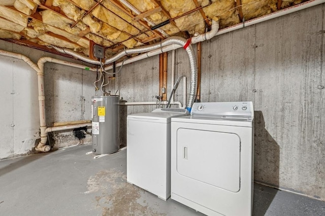 washroom with electric water heater and washing machine and dryer