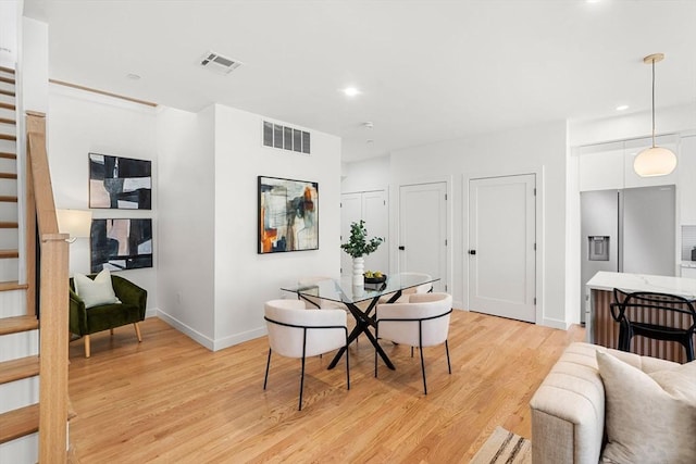 dining space featuring light hardwood / wood-style floors