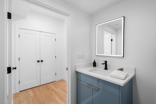 bathroom featuring hardwood / wood-style flooring and vanity