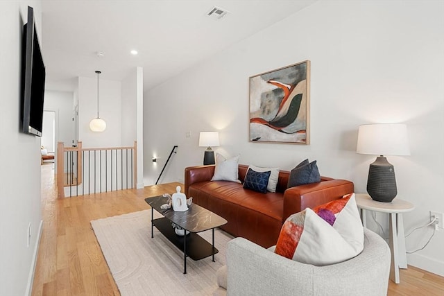 living room with light hardwood / wood-style floors