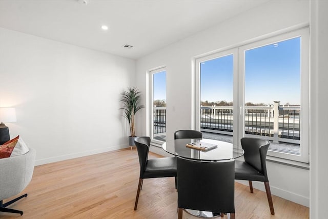 dining area with light wood-type flooring