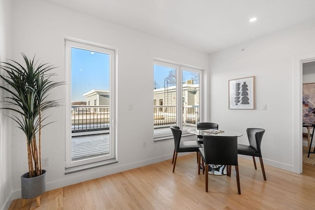 dining area with light wood-type flooring