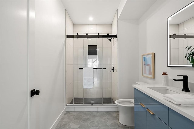 bathroom featuring toilet, tile patterned floors, vanity, and a shower with shower door