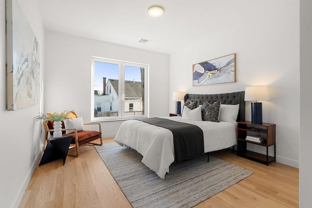 bedroom with light hardwood / wood-style flooring