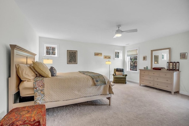 bedroom featuring baseboards, carpet flooring, and ceiling fan