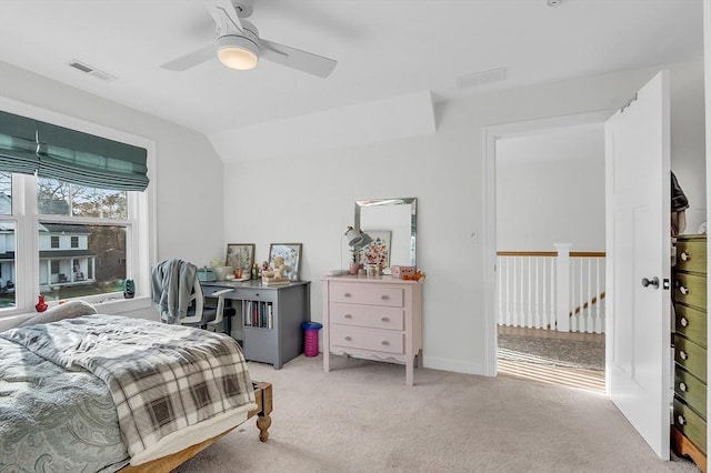 bedroom with visible vents, a ceiling fan, lofted ceiling, and light carpet
