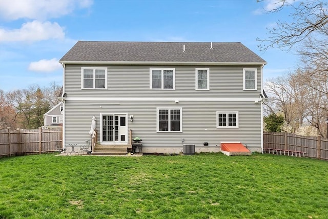 back of house with a fenced backyard, cooling unit, a yard, and entry steps