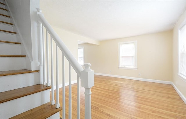 stairway featuring wood-type flooring