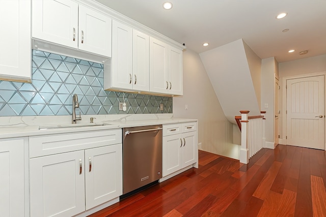 kitchen featuring dishwasher, light stone countertops, sink, and dark wood-type flooring