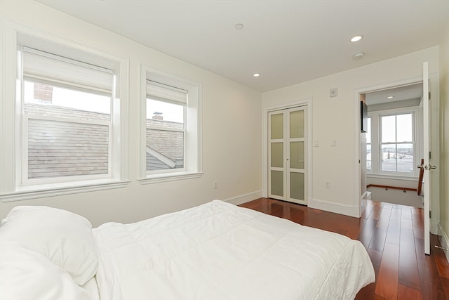 bedroom featuring dark wood-type flooring