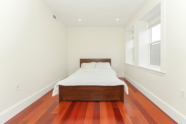 bedroom with hardwood / wood-style flooring