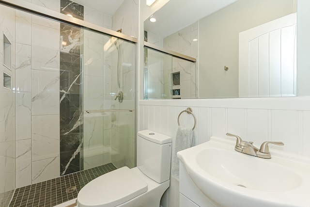 bathroom featuring vanity, toilet, and walk in shower