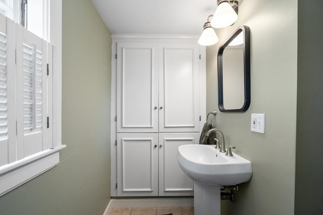 bathroom featuring tile patterned floors and a healthy amount of sunlight