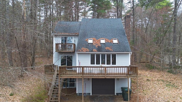 207 Monson Turnpike Rd, Ware, MA 01082 - view of front facade featuring a shingled roof, a chimney, a garage, and a deck