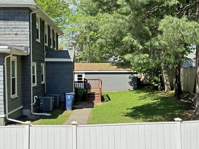 view of yard with central AC unit