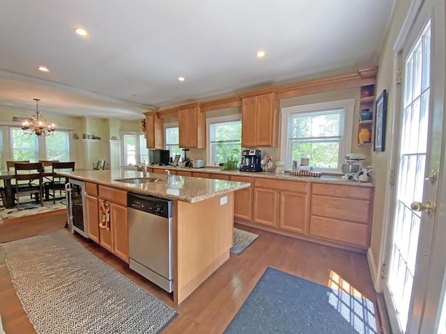 kitchen featuring dishwasher, light brown cabinets, wine cooler, a sink, and recessed lighting